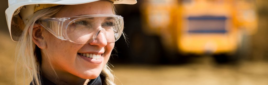eager apprentice in mining field smiling